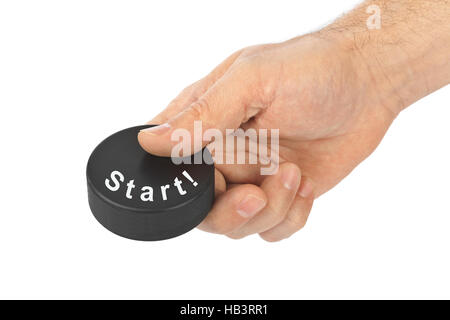 Mano con disco da hockey inizio Foto Stock