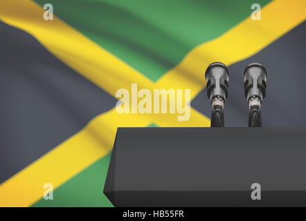 Pulpito e due microfoni con una bandiera su sfondo - Giamaica Foto Stock