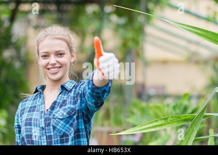 Fioraio con il pollice in alto Foto Stock