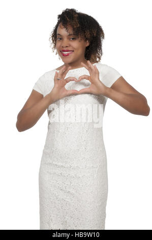 Donna che fa il segno del cuore Foto Stock