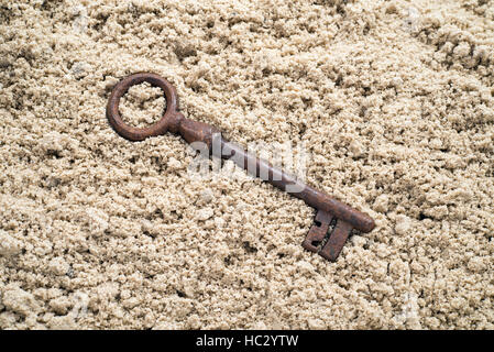 Key smarrita in sabbia. Trovare un'opportunità Foto Stock