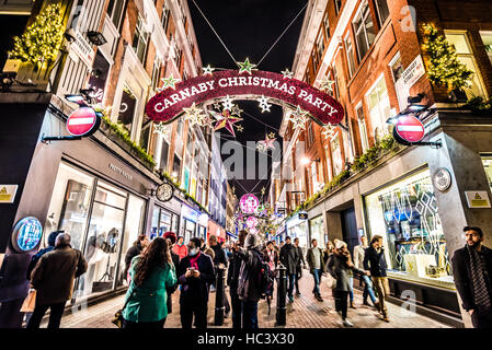 Le luci di Natale a Carnaby Street, Londra, Regno Unito Foto Stock