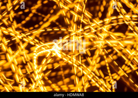 Arancio brillante linea tratteggiata luci sfondo astratto Foto Stock