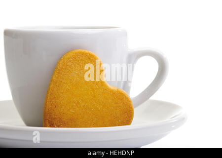 Tazza di caffè e a forma di cuore biscotto Foto Stock