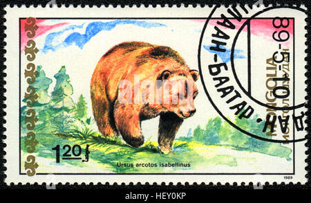 Un francobollo stampato in Mongolia mostra Himalayan orso bruno, 'Porta', serie 1989 Foto Stock