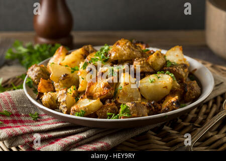 In casa arrosto di topinambur Sunchokes con aglio e formaggio Foto Stock