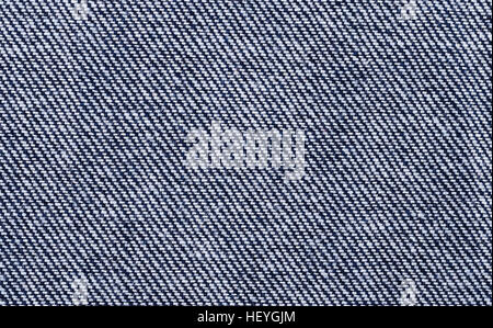 Blu Denim tessile foto macro. Superficie di cotone robusto di ordito del tessuto di fronte. Foto Stock
