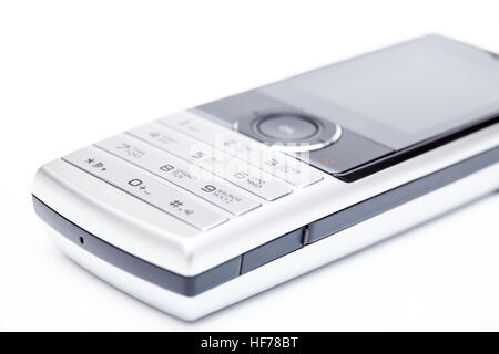 Il telefono cellulare è in toni di grigio chiaro sul bianco sfondo isolato Foto Stock