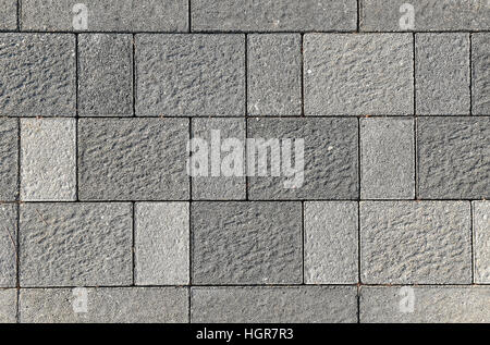Calcestruzzo o ciottoli pavimentazione grigio lastre o pietre per pavimento, parete o percorso. Recinzione tradizionali, Corte, nel cortile o pavimentazione stradale. Foto Stock