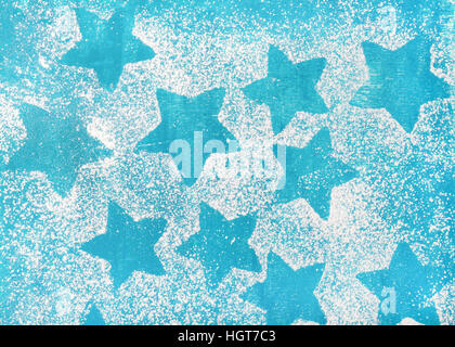 A forma di stella biscotti sagome luminose su sfondo blu Foto Stock