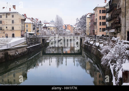 View of river Ljubljanica, Ljubljana, Slovenia, covered with snow Foto Stock