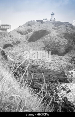 Faro, il bersaglio di treking in Seopjikoji. Si trova alla fine della sponda orientale dell'isola di Jeju, Corea del Sud Foto Stock