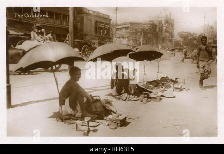 Cobblers sulla strada, Delhi, India Foto Stock