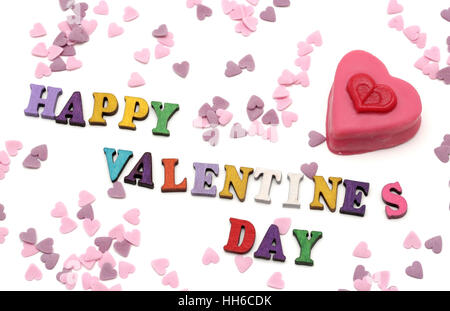 Felice il giorno di San Valentino con una a forma di cuore ad petit fours Foto Stock
