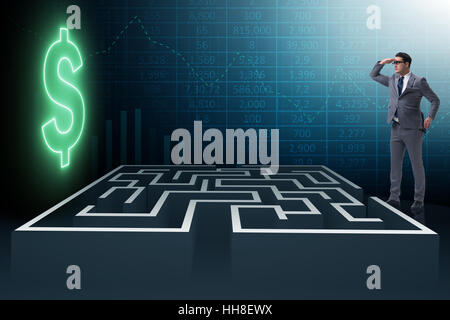 Uomo che cerca di raggiungere dollari attraverso il labirinto Foto Stock