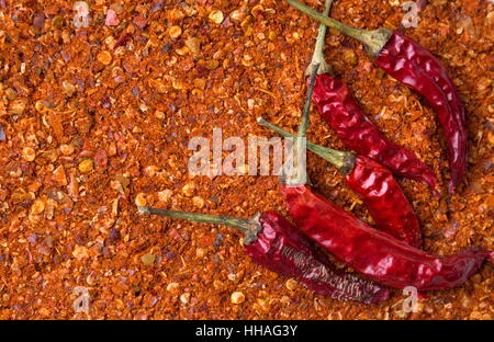 Peperone rosso sulla sommità paprika rossa sullo sfondo Foto Stock