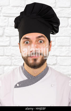 Divertente ritratto dello chef con la farina sulla faccia Foto Stock