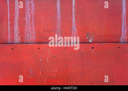 Dettagli del metallo rosso texture, danneggiato e la vecchia superficie, primo piano. Foto Stock