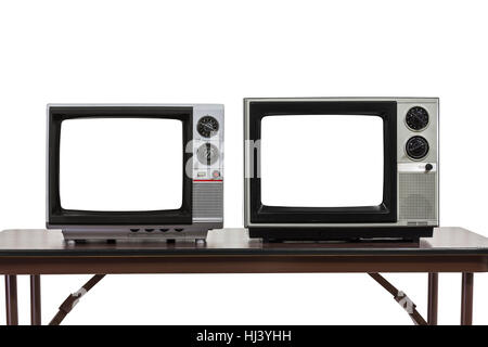 Due televisori vintage isolato su bianco con tagliare fuori gli schermi. Foto Stock