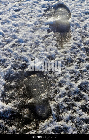 Footprints in ghiaccio Foto Stock