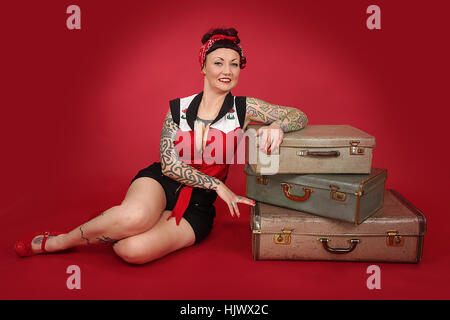 Anni Cinquanta pin up girl con le valigie Foto Stock