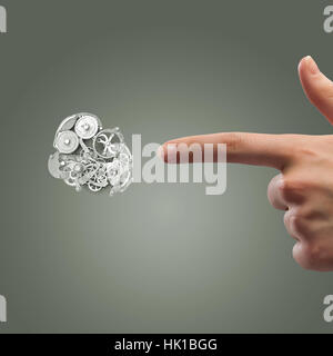 Stretta di mano e meccanismo di ingranaggi su sfondo grigio Foto Stock