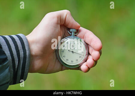 Il cronometro in una mano Foto Stock