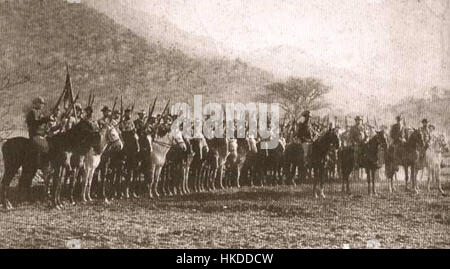 Questo dipinto raffigura un commando boero durante la seconda guerra boera, ambientato a Pretoria nel 1899. L'opera d'arte cattura l'atmosfera militare della guerra, mettendo in evidenza le azioni dei soldati e il significato storico del conflitto nella storia sudafricana. Foto Stock