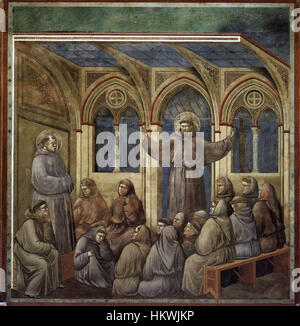 "Leggenda di San Francesco - apparizione ad Arles" di Giotto di Bondone fa parte di una serie che descrive la vita di San Francesco d'Assisi. Il dipinto mostra una visione religiosa, che illustra la maestria dello spazio e delle emozioni di Giotto. Foto Stock