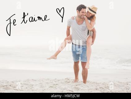 Digital immagine composita dell'uomo dando piggy back per donna in spiaggia Foto Stock