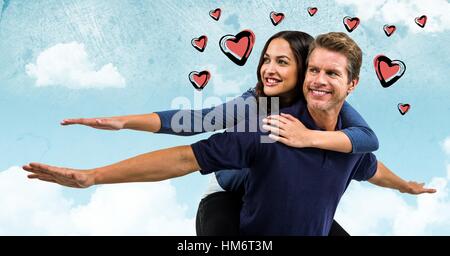 Digital immagine composita dell'uomo dando piggy back per donna Foto Stock