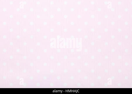 Pink polka dot fabric background texture Foto Stock