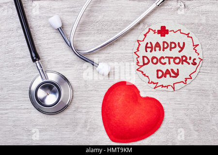 Felice medico della Giornata della carta di saluto. Foto Stock