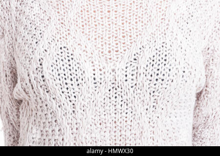 Close-up femminile di lana bianca sweaterClose di bianco femminile maglione di lana Foto Stock