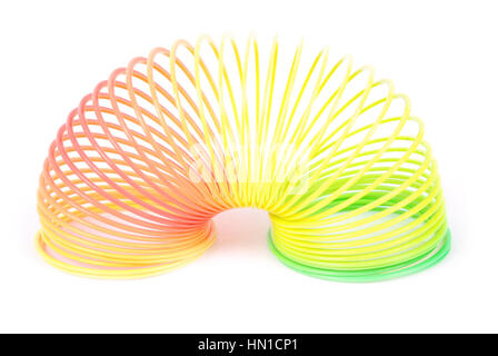 Molla Slinky toy isolato su bianco. Rainbow giocattolo a molla. Foto Stock
