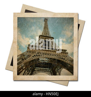 Vintage instant photo frame di carta con la torre Eiffel shot isolato su bianco Foto Stock