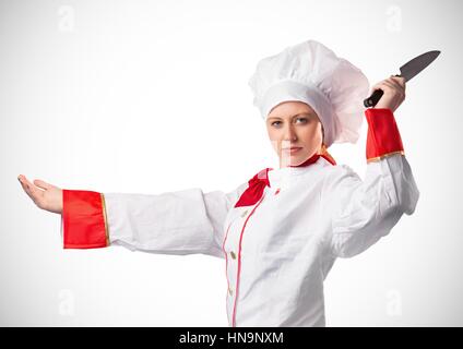 Composito Digitale dello Chef con il coltello contro uno sfondo bianco Foto Stock