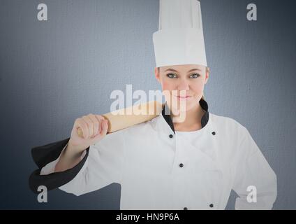 Composito Digitale dello Chef con il mattarello contro lo sfondo della marina Foto Stock