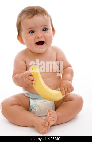 Modello di rilascio, Kleinkind in Windeln mit Banane in der mano - bambino con banana Foto Stock