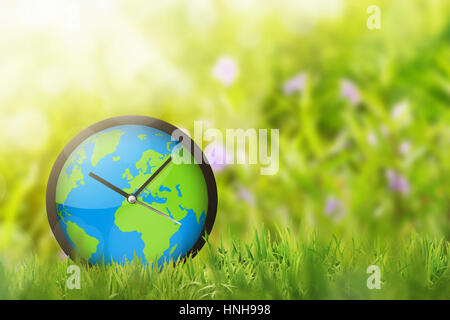 Orologio della terra nel campo. Earth Hour concetto. Foto Stock