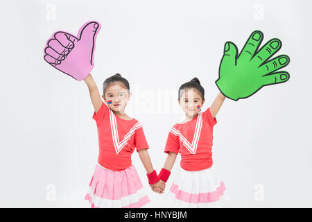 Sorridente twin cheerleader ragazze Foto Stock