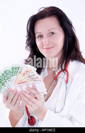 Modello di rilascio , aerztin mit Geld - medico con il denaro Foto Stock