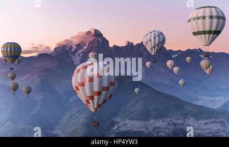 Colorate mongolfiere volare oltre la montagna. Foto Stock