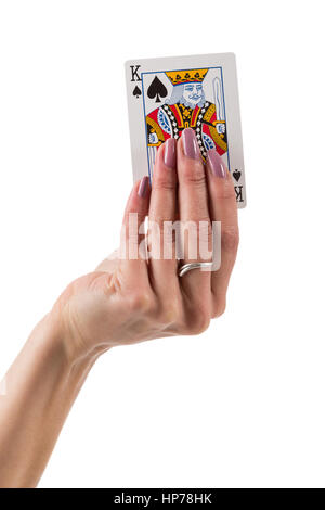 Mano femminile che mostra picche signore card isolate su sfondo bianco Foto Stock