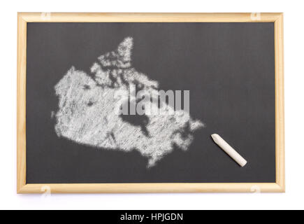 Lavagna con un gessetto e la forma del Canada disegnati sullo. (Serie) Foto Stock