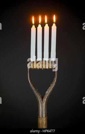 Quattro candele (forcella maniglie) Foto Stock