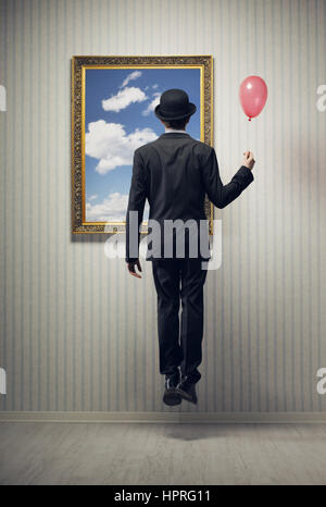 Sogno di un uomo d affari e volare alto Foto Stock