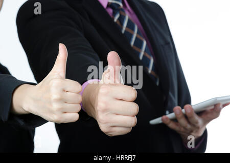 Due happy business partner sono mantenendo i pollici in su. Close-up. Foto Stock