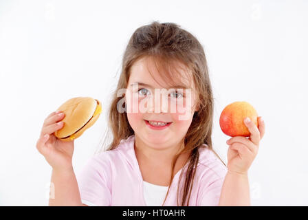 Molliges M?dchen mit Burger und Apfel - chubby ragazza con burger e Apple Foto Stock