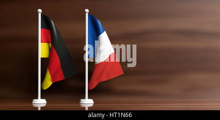 La Francia e la Germania bandiere in miniatura su sfondo di legno. 3d illustrazione Foto Stock